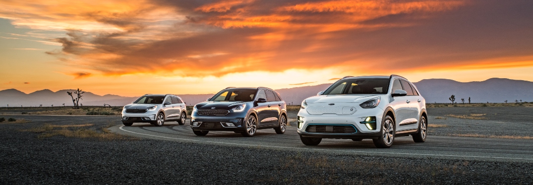 Three 2019 Kia Niro Models Parked in Front of Sunset