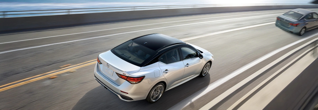 2024 White Nissan Sentra Driving Around Curve