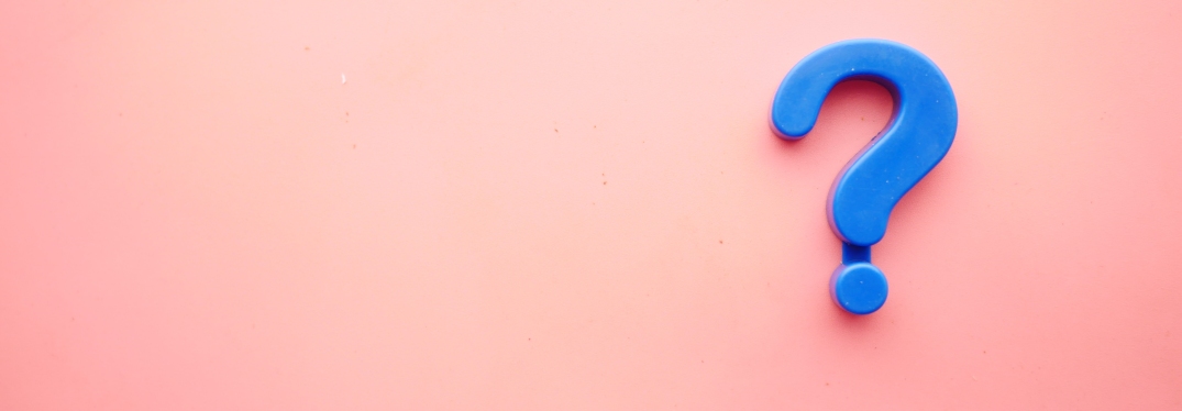 Blue Question Mark on Pink Background