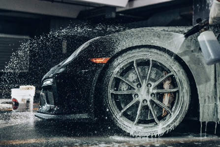 Black car being washed