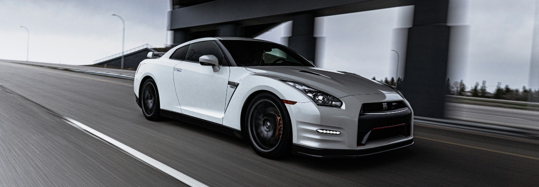 Silver car driving on road