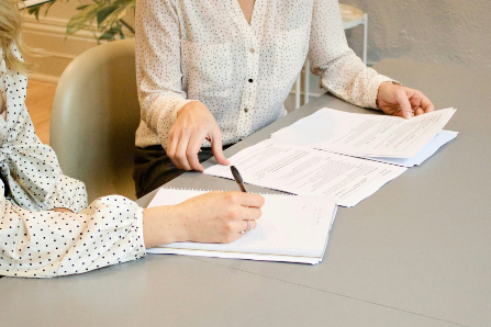 Woman signing papers
