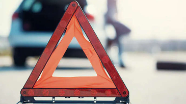 Red and orange hazard marker on road