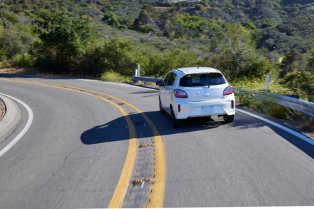Mitsubishi Mirage Driving on Highway by Trees